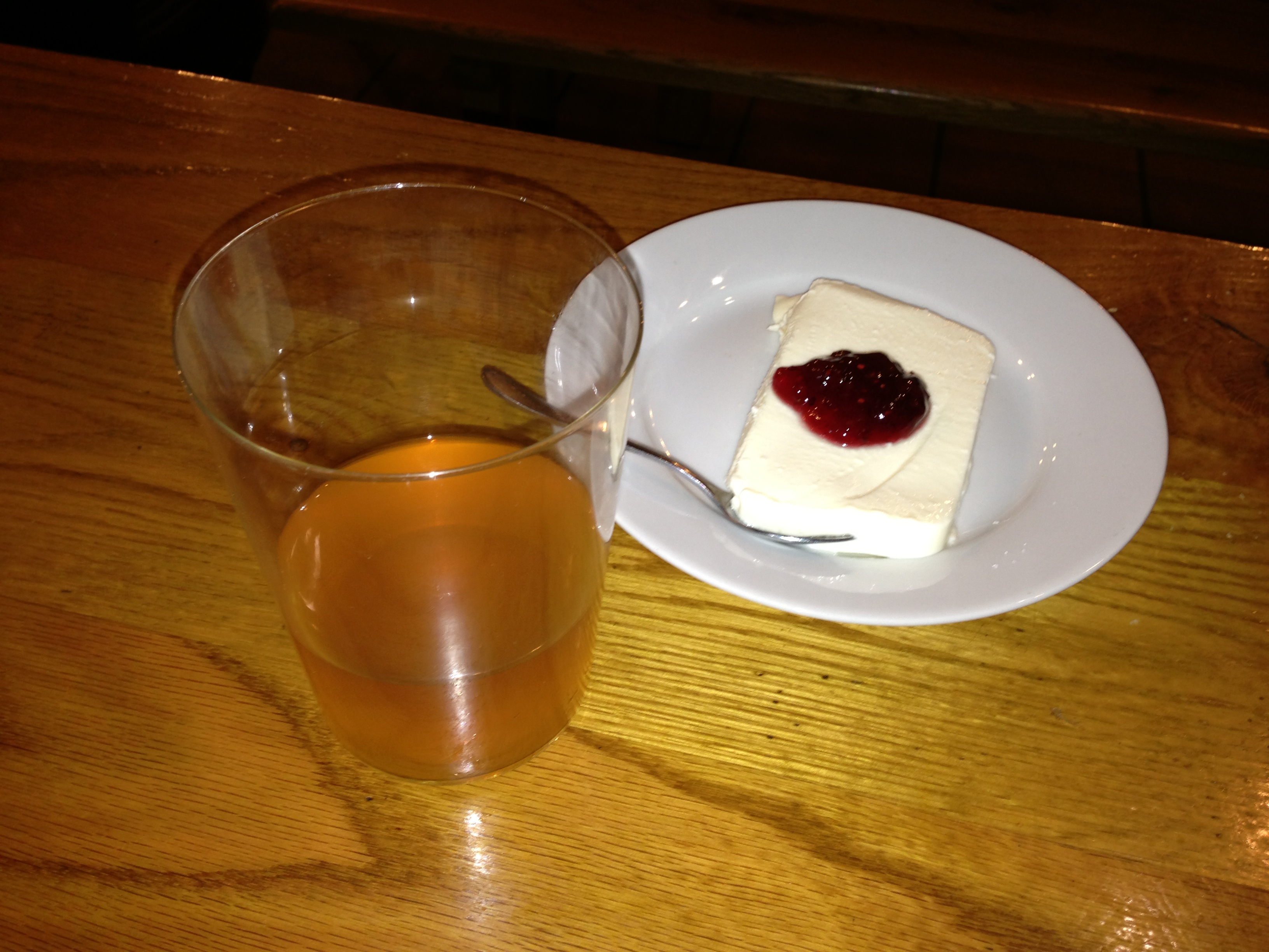 Daniel Aronoff with the dessert and a glass of cider in front of him.